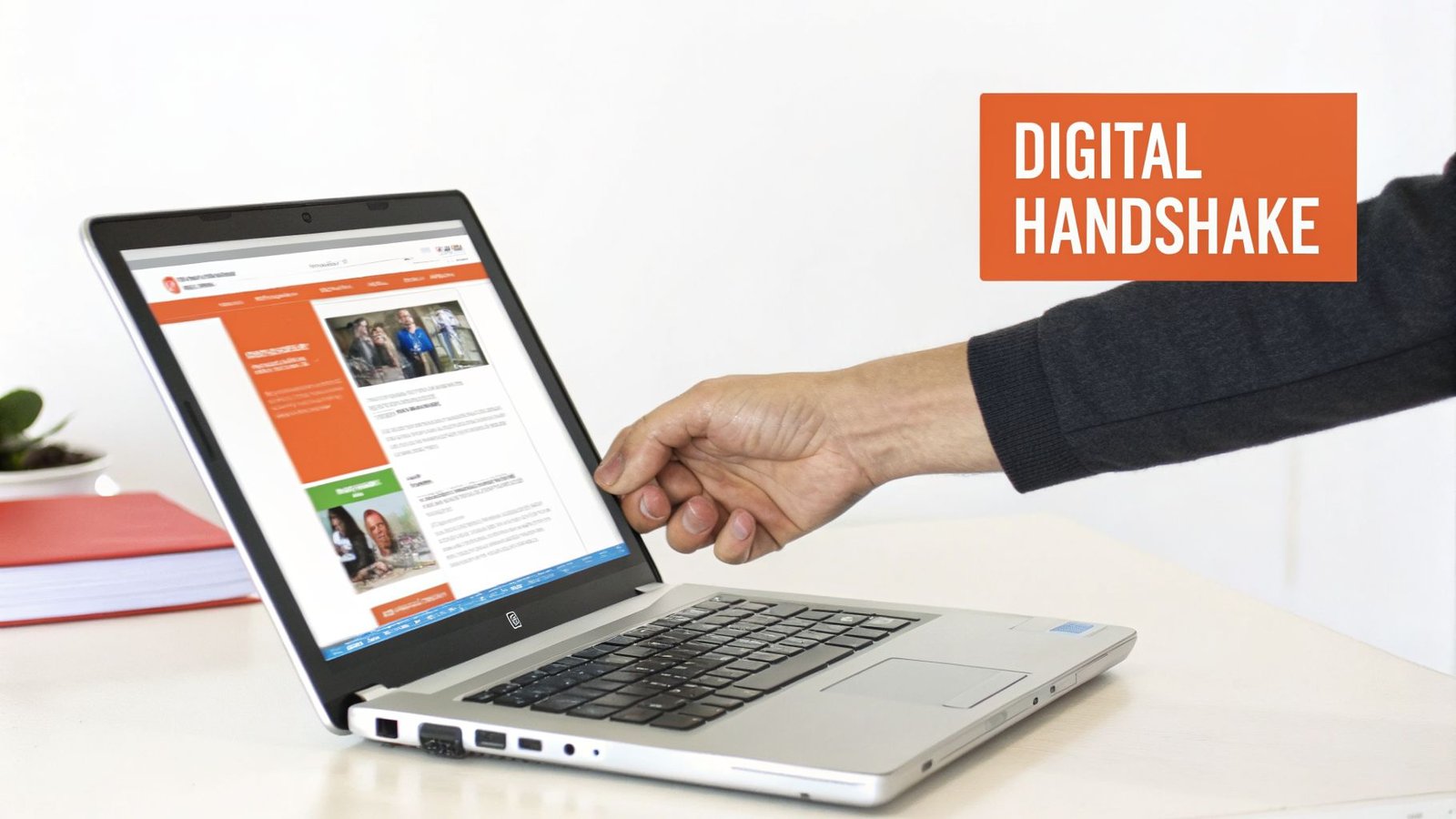 A hand interacts with a laptop screen displaying a webpage, alongside text “DIGITAL HANDSHAKE” in an orange box.