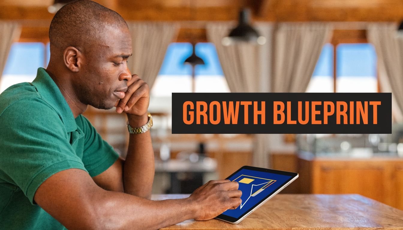 A man in a green shirt studies a restaurant growth strategy blueprint on his digital tablet.